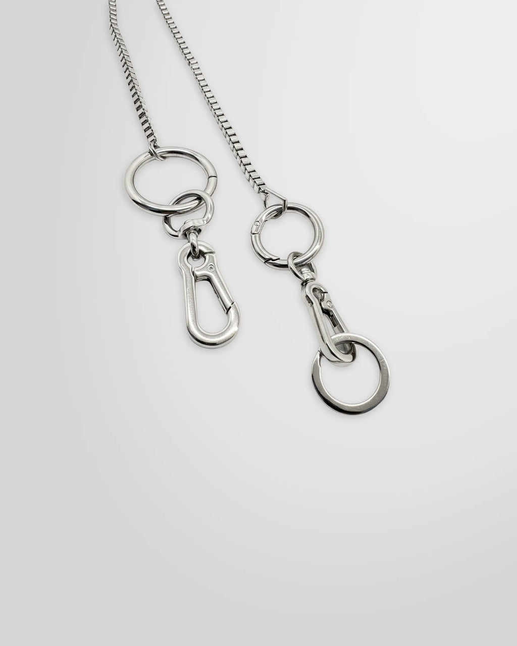 Close up view of the Not Guilty Homme silver utility Box Chain accessory.