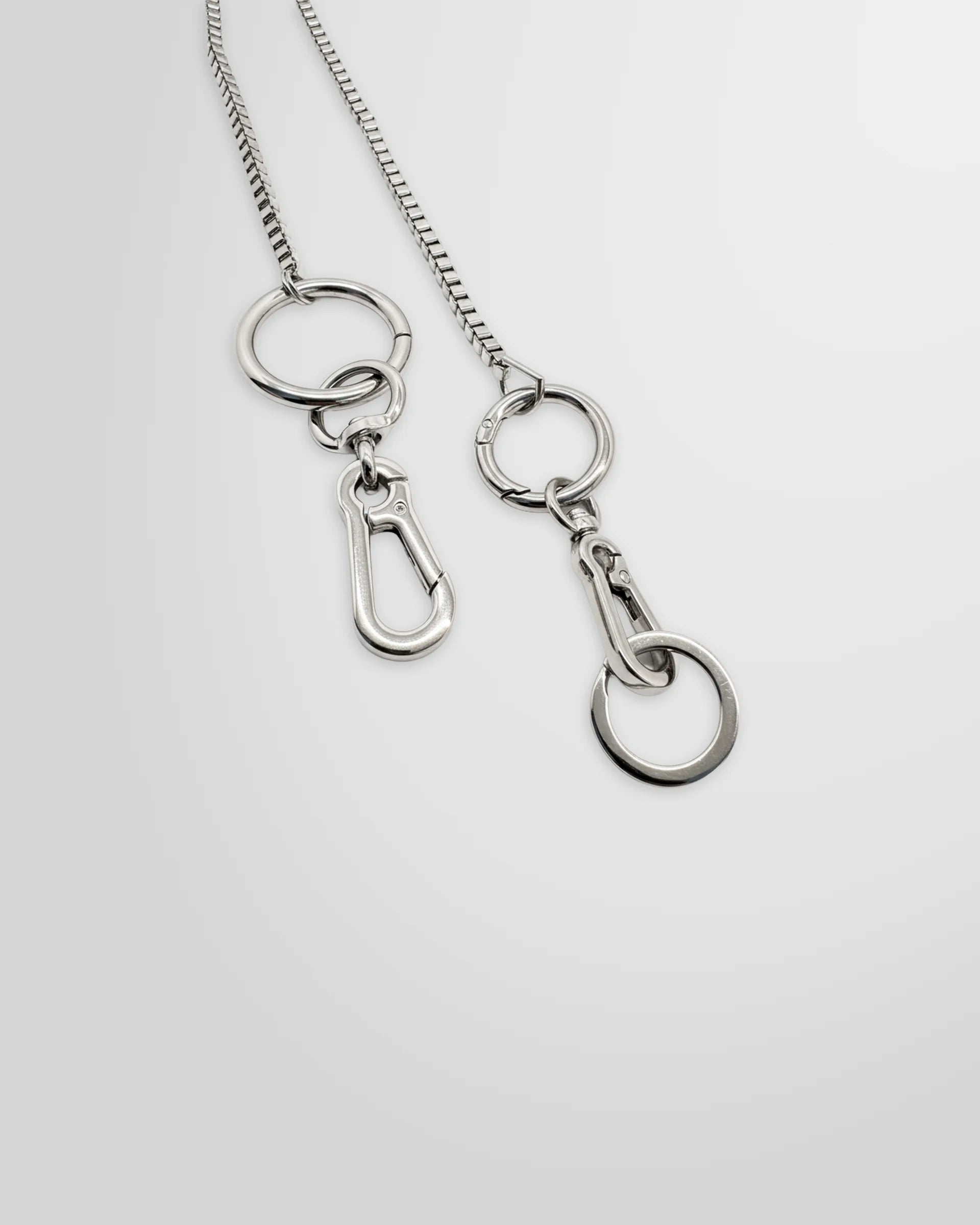 Close up view of the Not Guilty Homme silver utility Box Chain accessory.
