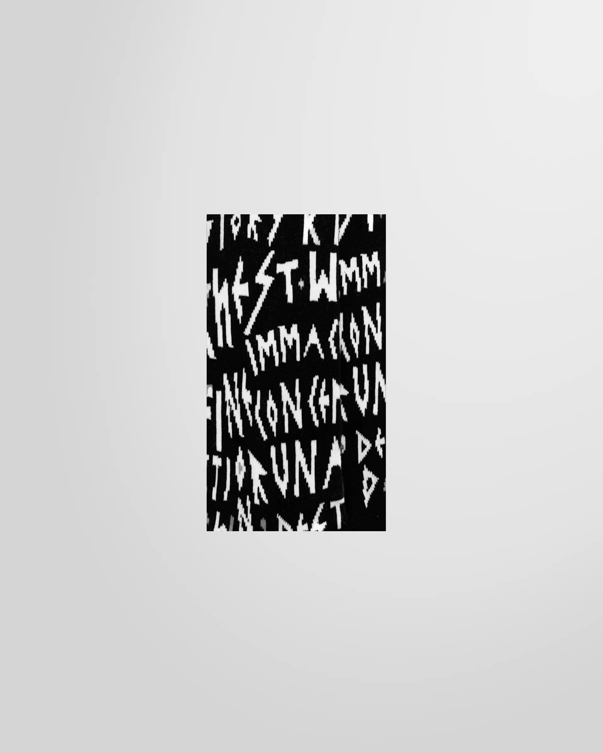 Close-up view of the letter embroidered detail, designed by KTZ