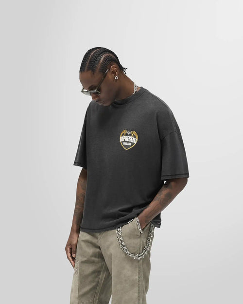 Model wearing the Represent Angel Border T‑Shirt in Stained Black, boxy fit.