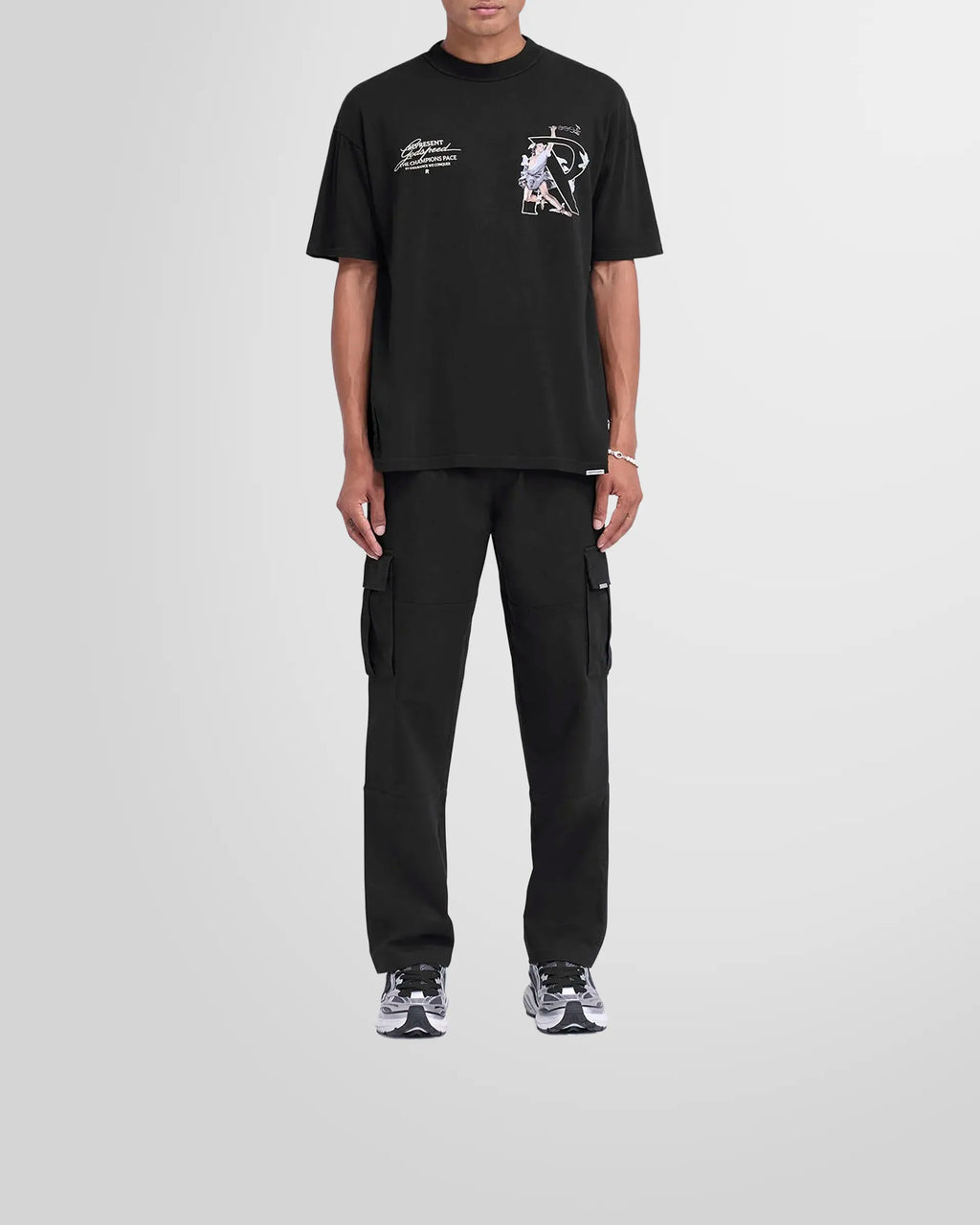 Front view of the Represent Cargo Pant in black on a model.