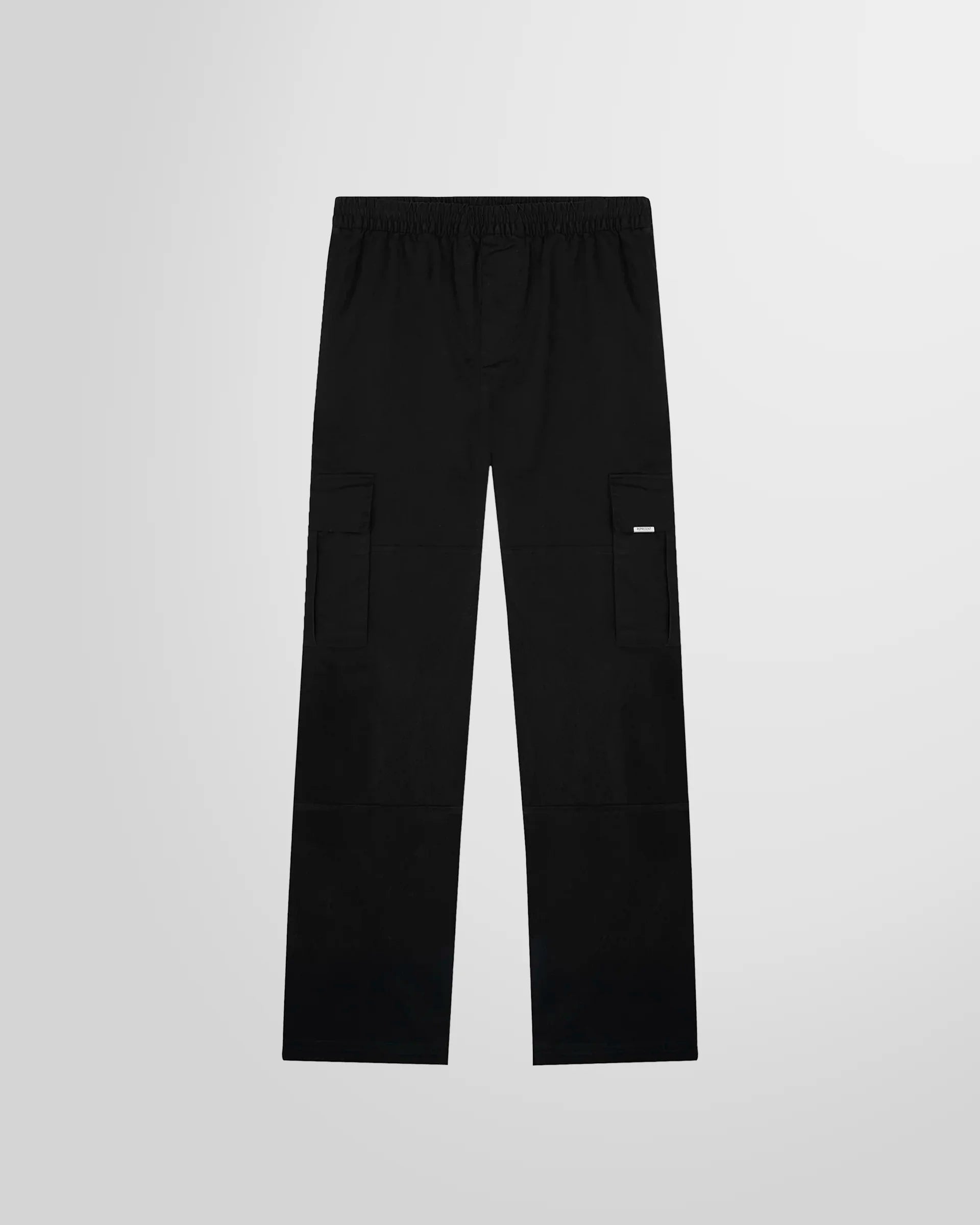 Front view of the Represent Cargo Pant in black, showing the slimmer regular fit.