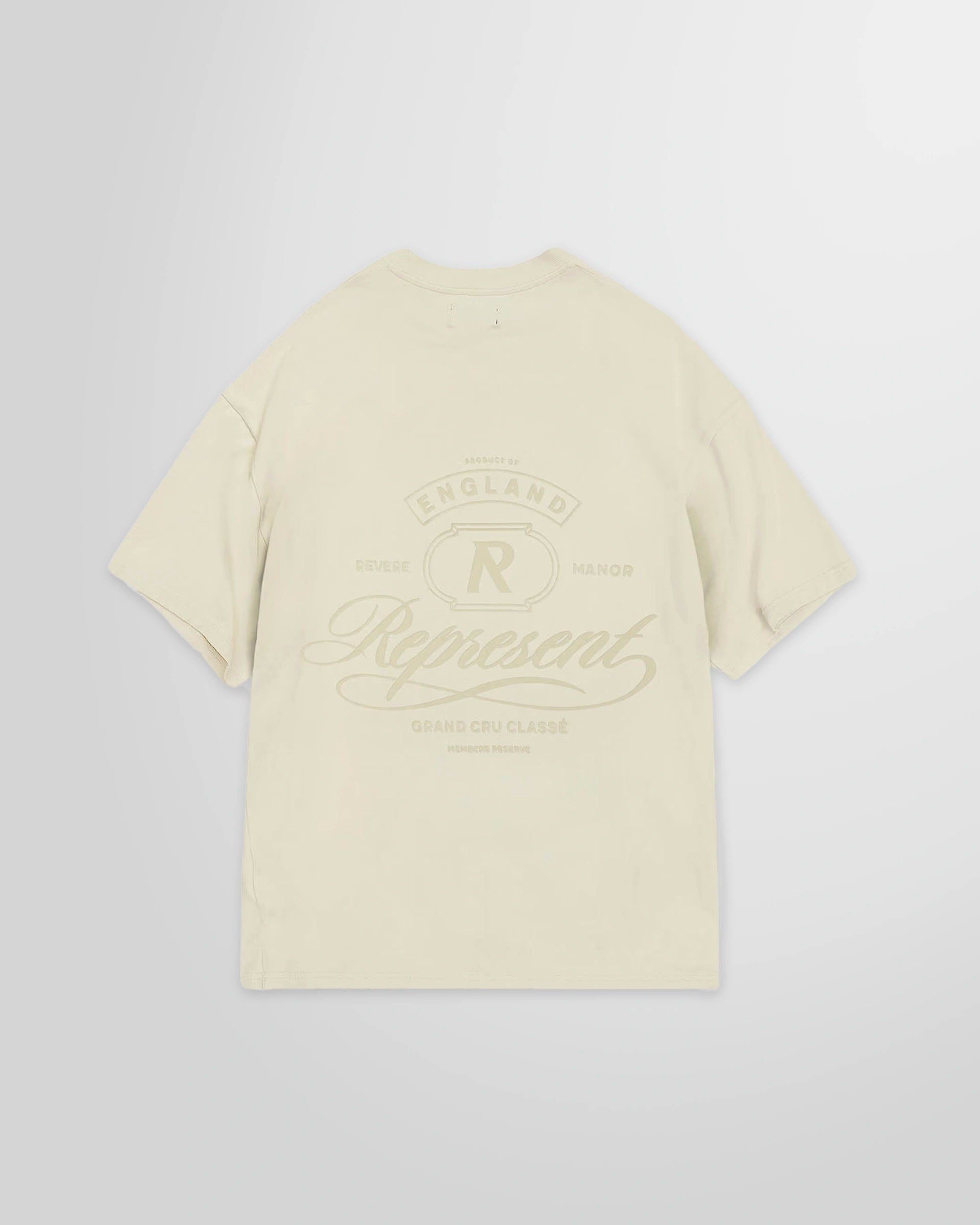 Back view of the Represent Grand Vintage T-Shirt in Champagne with the rear tonal graphic.