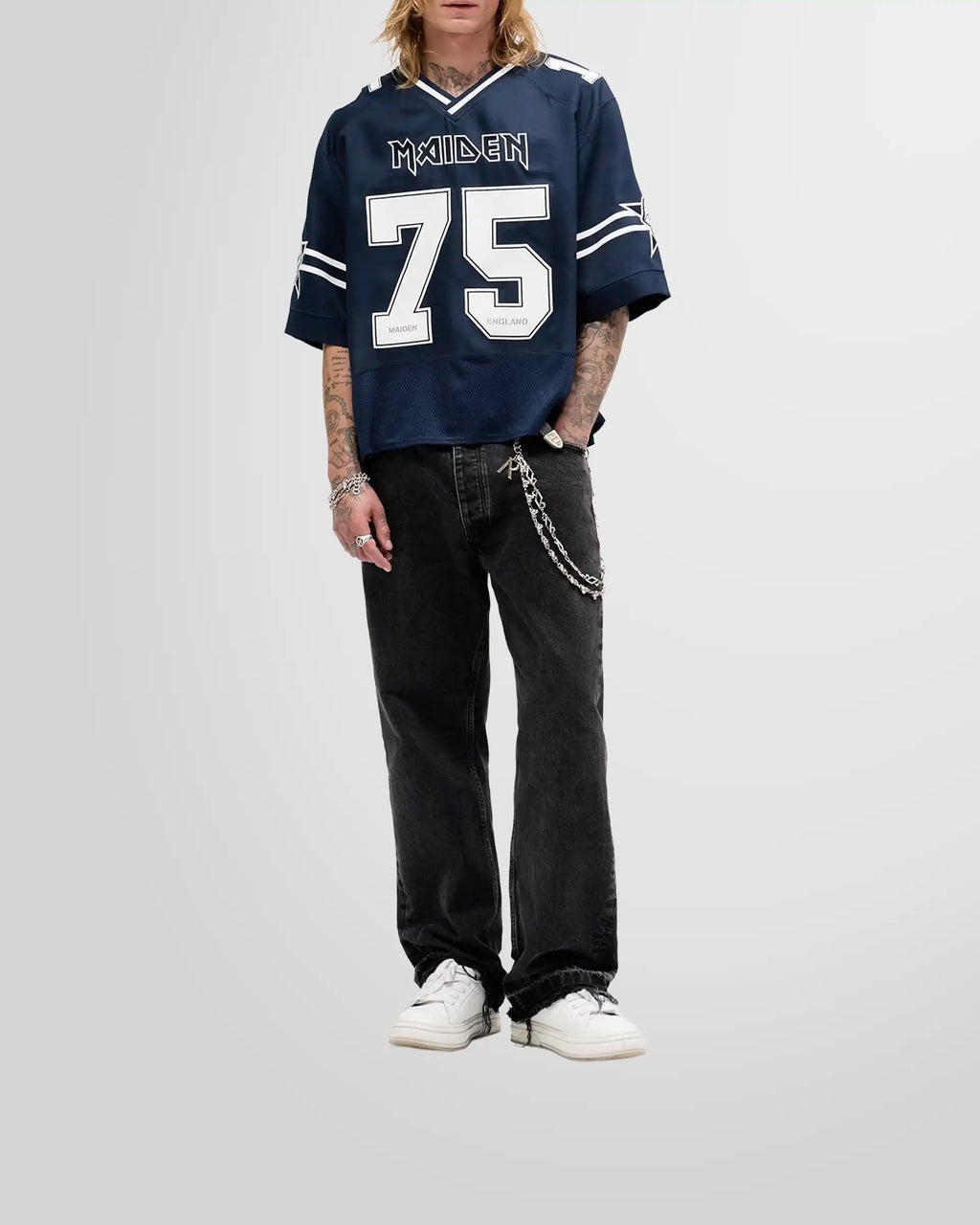 Model wearing the oversized Represent x Iron Maiden Anniversary Jersey, showcasing its football-inspired silhouette.