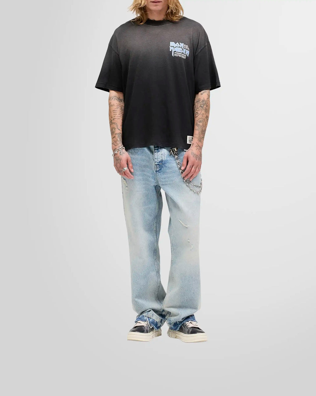 Model wearing the oversized Represent x Iron Maiden anniversary t-shirt, showcasing its shorter, boxy fit.