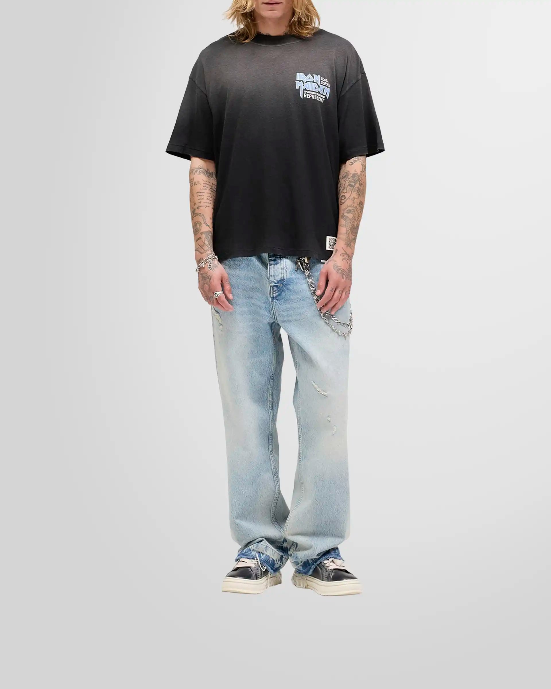 Model wearing the oversized Represent x Iron Maiden anniversary t-shirt, showcasing its shorter, boxy fit.