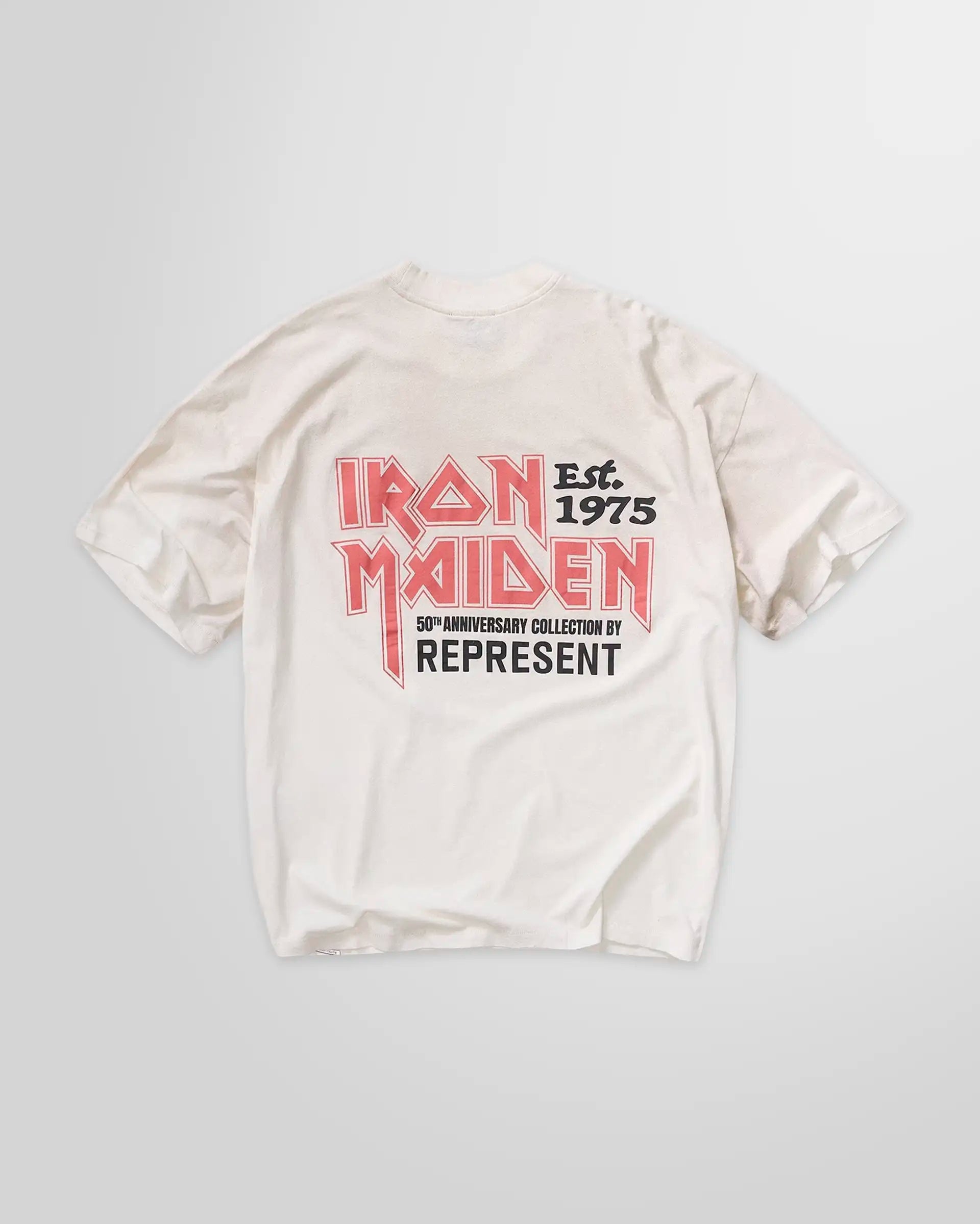 Back of the Represent x Iron Maiden anniversary t-shirt in washed ecru, displaying the rear graphic and oversized fit.