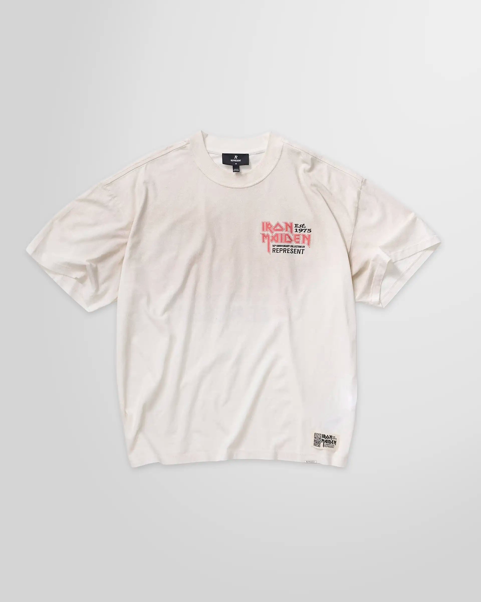 Front view of the Represent x Iron Maiden 50th Anniversary t-shirt in washed ecru, showing the main crack-print graphic.