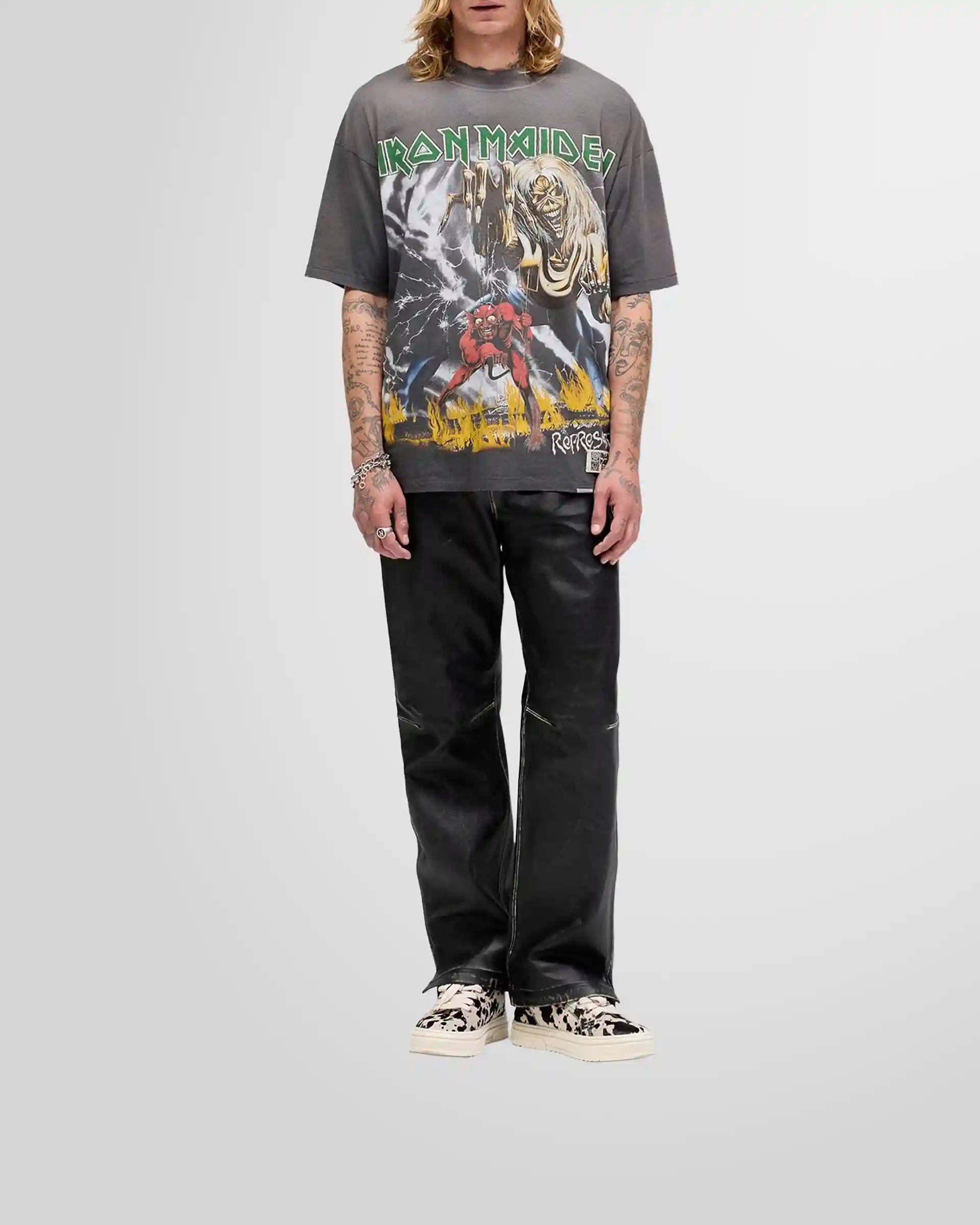 Model wearing the oversized Represent x Iron Maiden Number of the Beast t-shirt in sunfade grey.