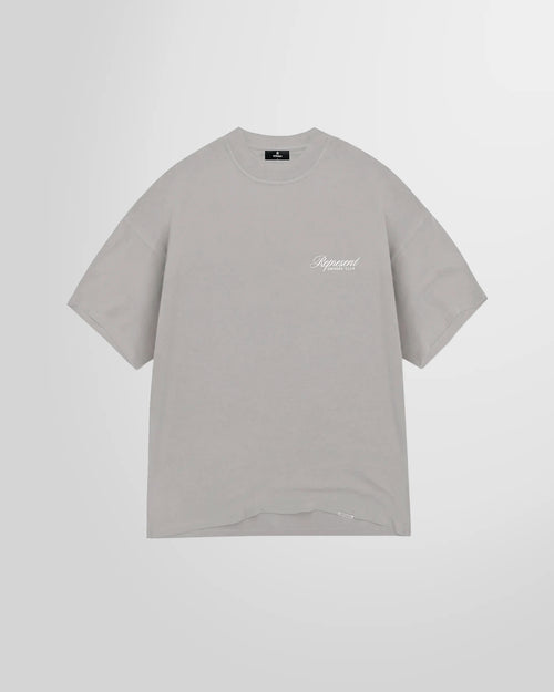 Front view of the Represent Owners Club Script T-Shirt in slate, showing the chest script logo.