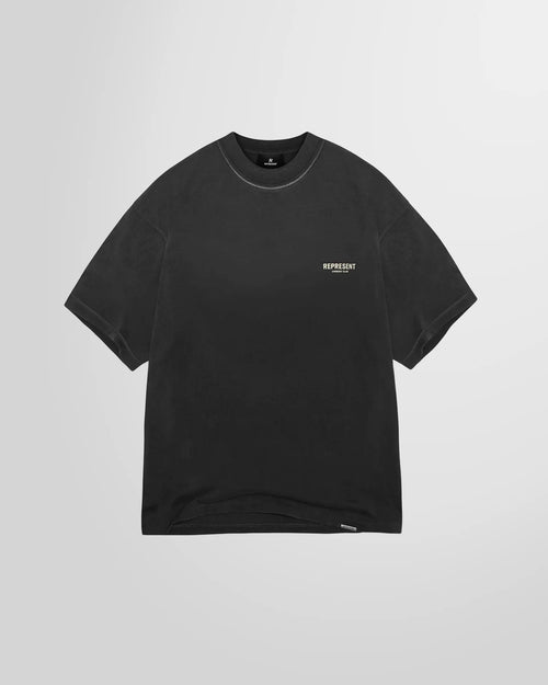 Front view of the Represent Owners Club T-Shirt in aged black, showing the chest logo.