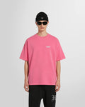 Model wearing the Represent Owners Club T-Shirt in pink showing the boxy fit.
