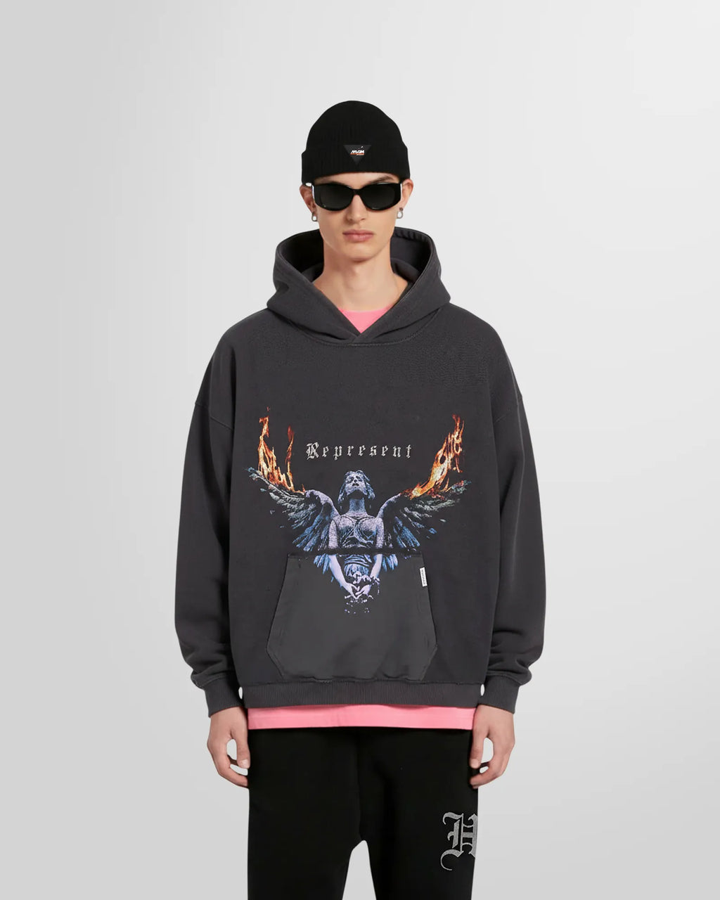 Model wearing the Represent Reversible Living Legacy Tour Hoodie in Sun Fade Grey, oversized boxy fit.