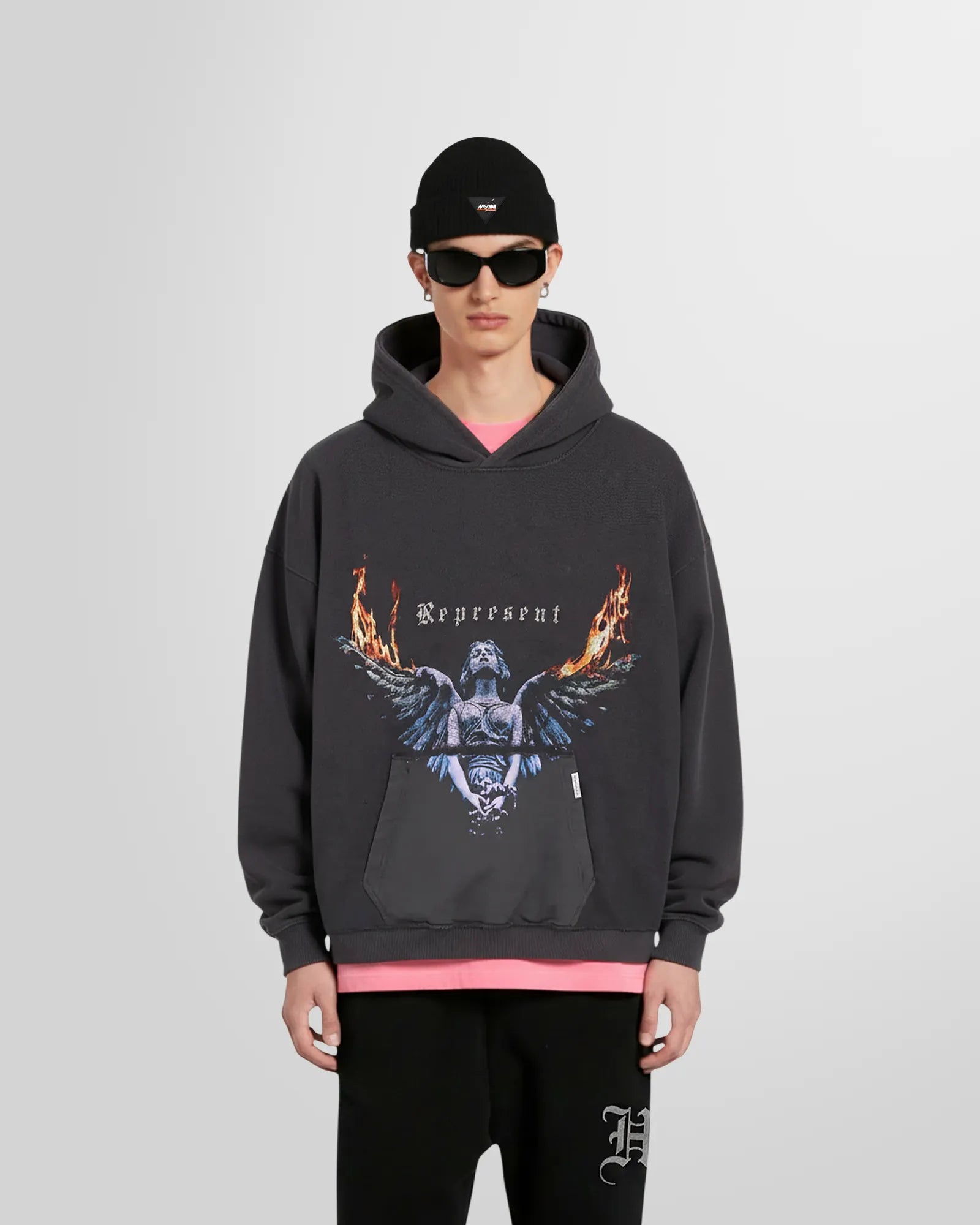 Model wearing the Represent Reversible Living Legacy Tour Hoodie in Sun Fade Grey, oversized boxy fit.