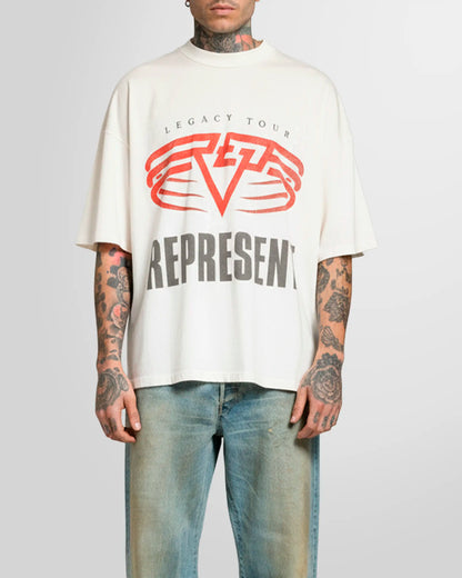 Model wearing the Represent Reversible Living Legacy Tour T‑Shirt in Flat White, front view, oversized fit.