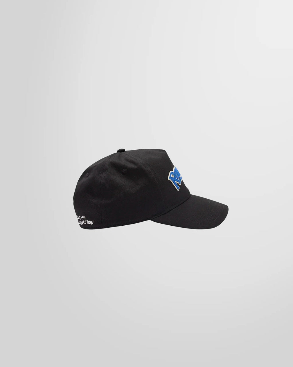 Side profile of the black Represent cap, showing the curved brim and structured cotton twill construction.