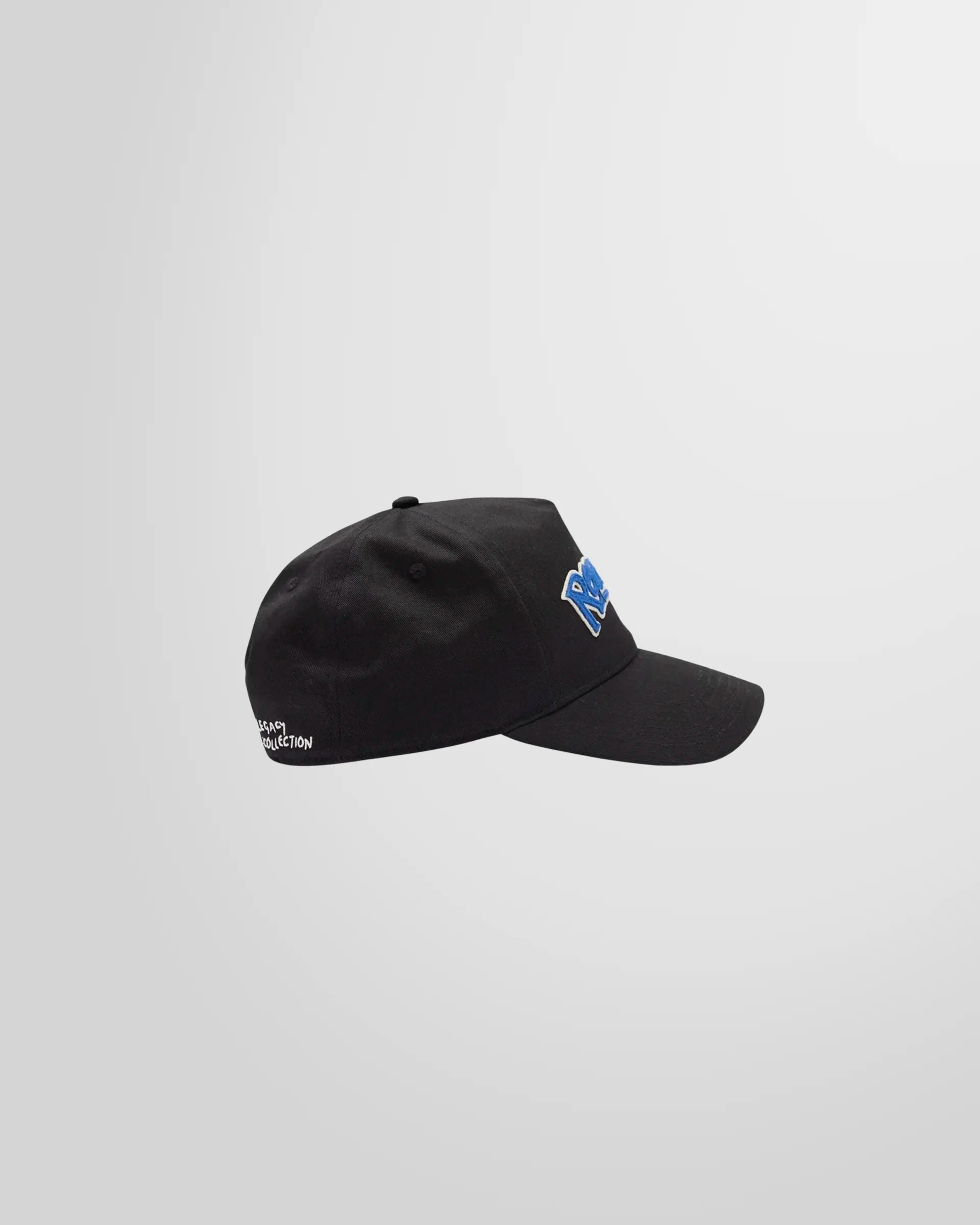 Side profile of the black Represent cap, showing the curved brim and structured cotton twill construction.