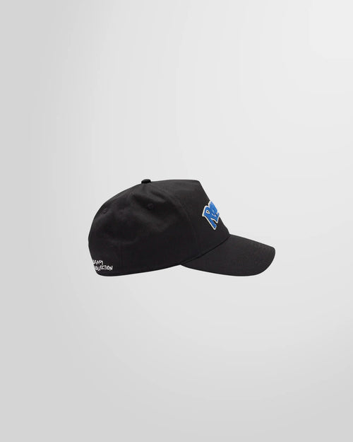 Side profile of the black Represent cap, showing the curved brim and structured cotton twill construction.