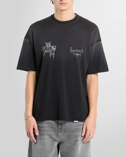 Model wearing the aged black Thoroughbred tee, front view, oversized fit.