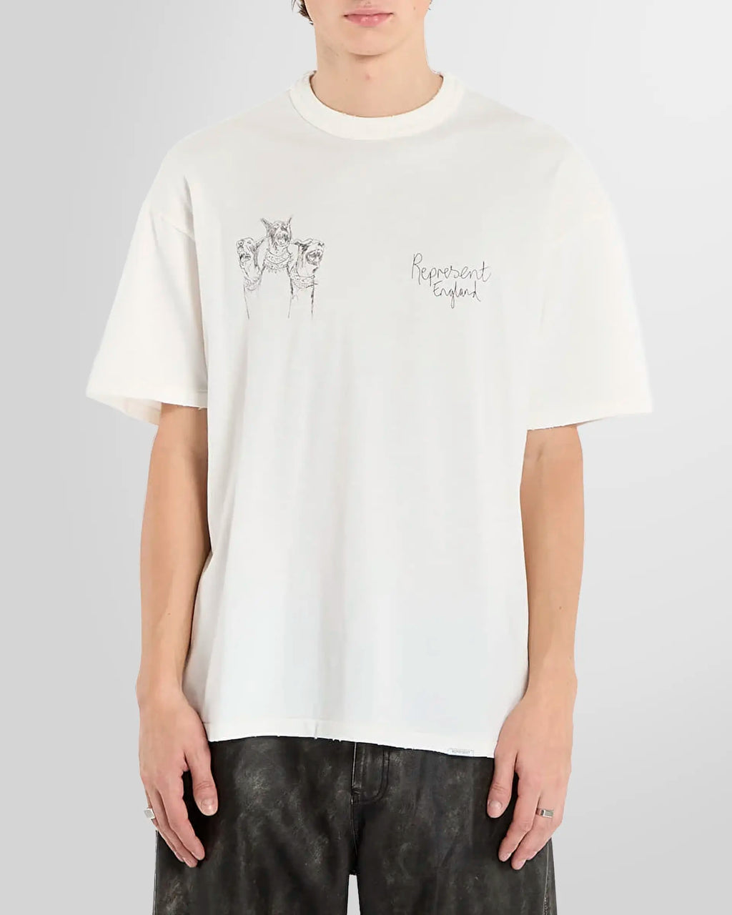 Model wearing the white Thoroughbred tee, front view, oversized fit.