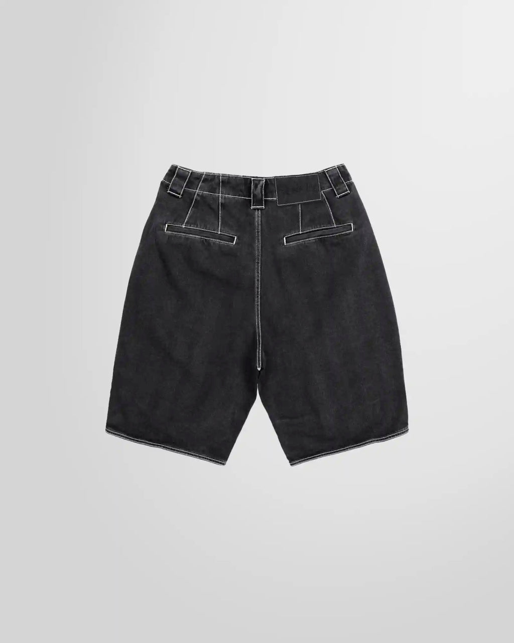 Studio photograph showing the back of the denim shorts from Sunnei in washed black with contrasting white stitching.
