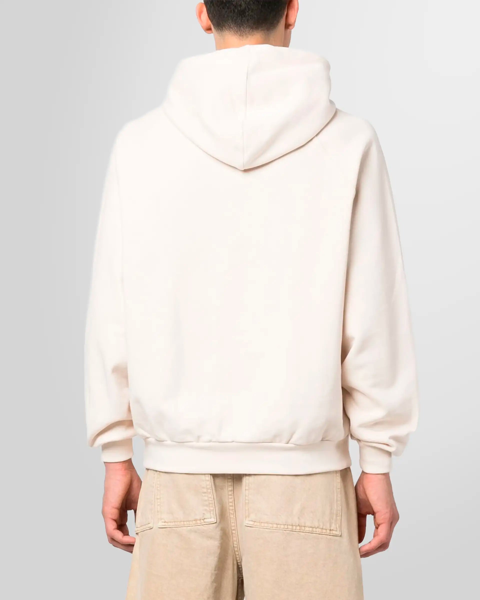 Back view of the light beige Sunnei hoodie, showing the clean design and ribbed hem.