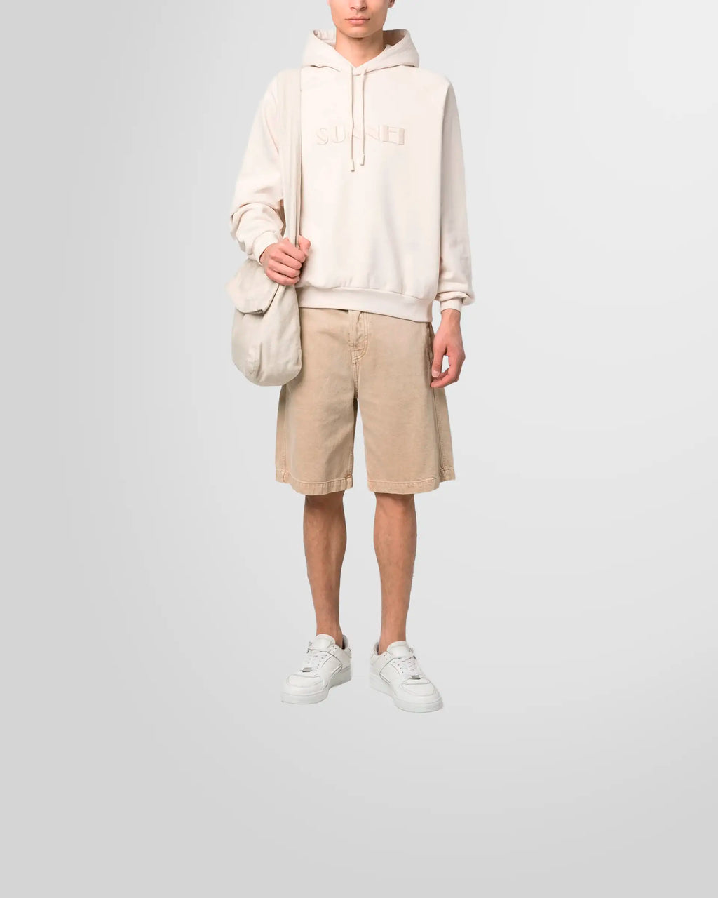 Model wearing the Sunnei embroidered logo hoodie, showcasing its relaxed fit and minimalist aesthetic.