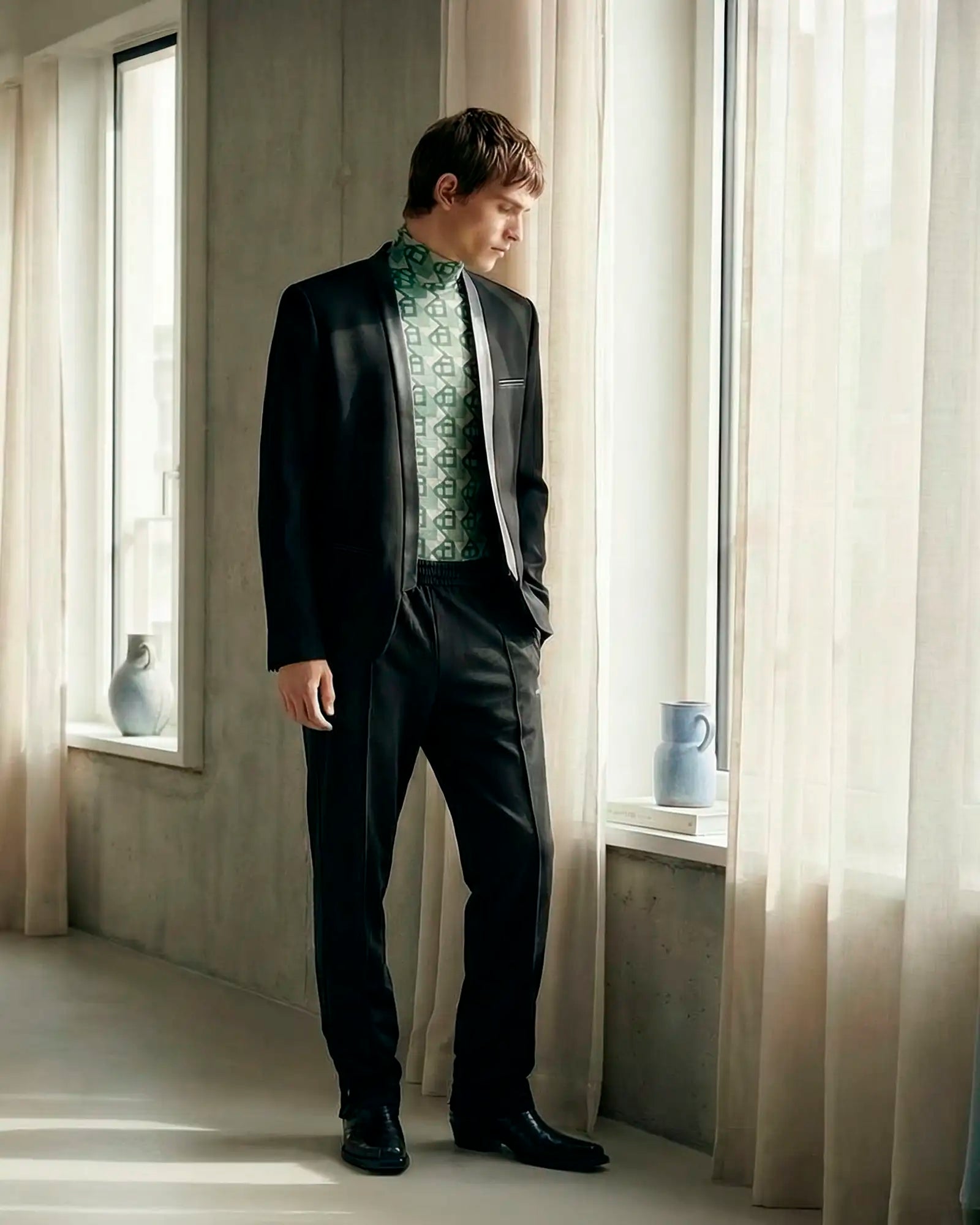 THE STATEMENT MAKER collection hero with bold, graphic menswear look.