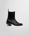 Side profile of the Toga Virilis black Chelsea boots, showing the croc-embossed leather and signature Western hardware on the heel.