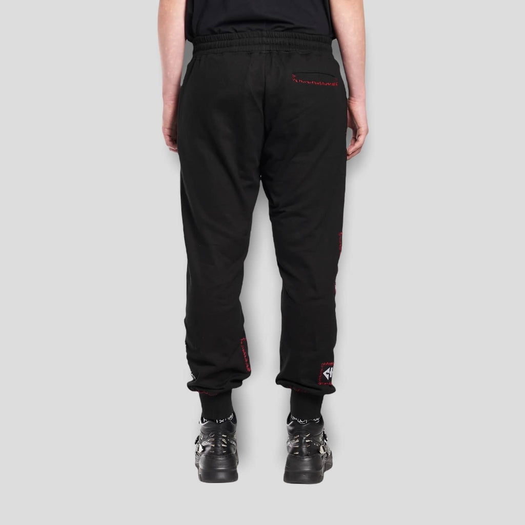 Back view of the black KTZ Multi-Patch Track Pants.
