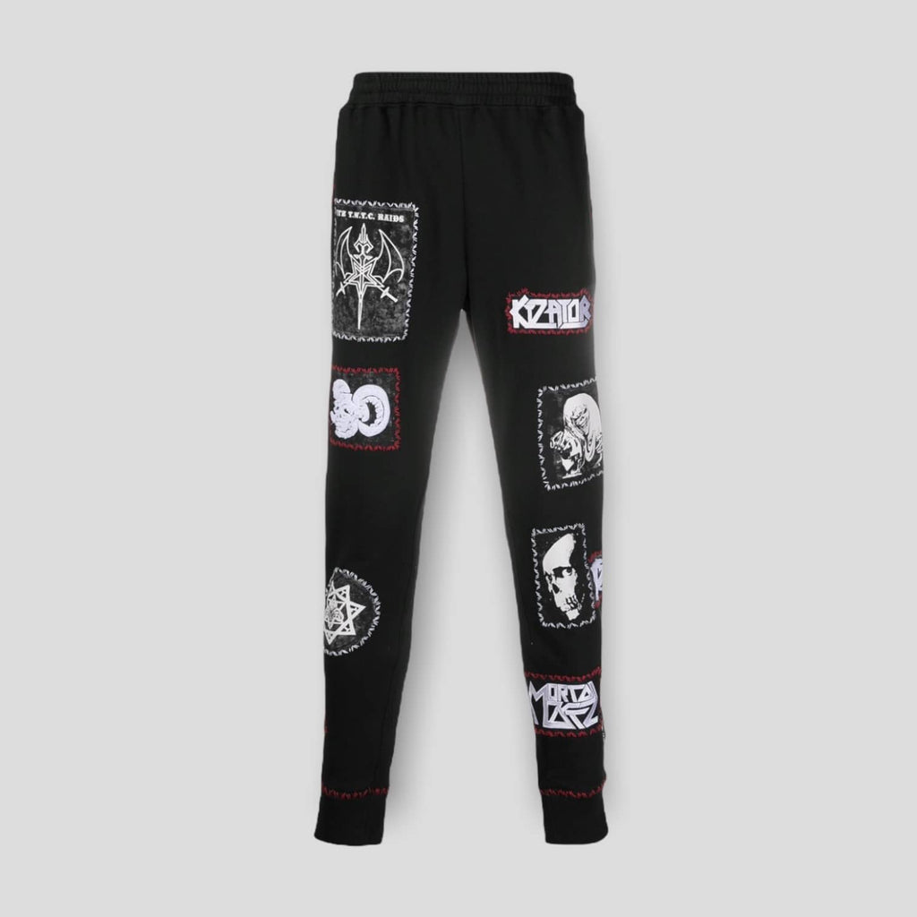 Front view of the KTZ Stitched Multi-Patch Track Pants in black, showing the collage of logo patches.