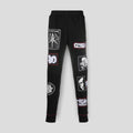 Front view of the KTZ Stitched Multi-Patch Track Pants in black, showing the collage of logo patches.